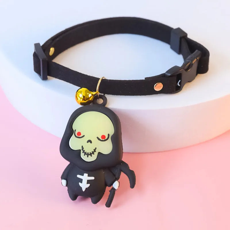 Halloween dog collar with pumpkin man and glow-in-the-dark skull designs in adjustable sizes.