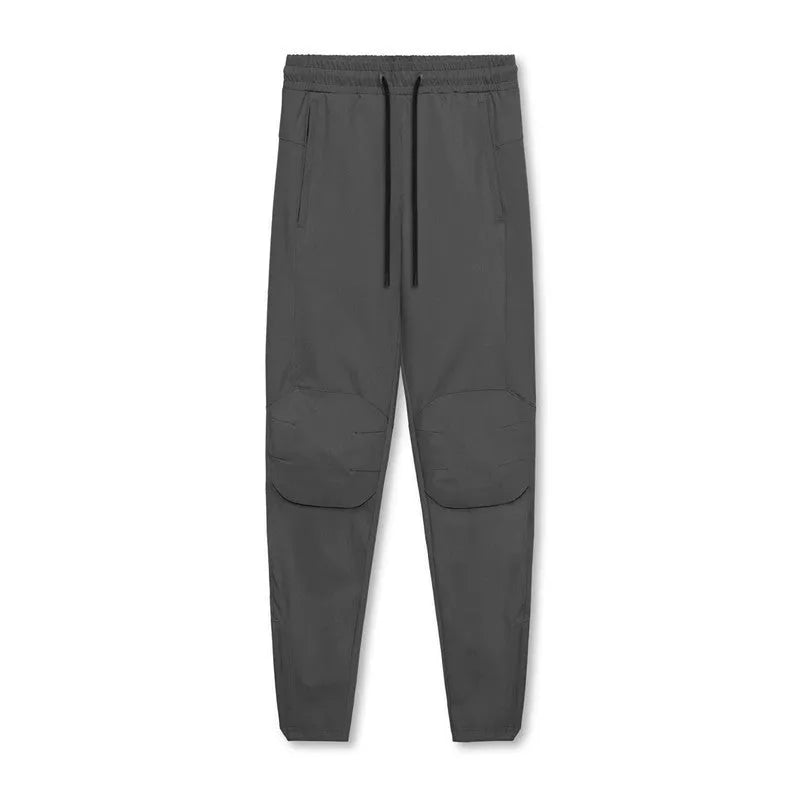 Men's grey ankle-tied running trousers for fitness exercise with quick-dry polyester fabric
