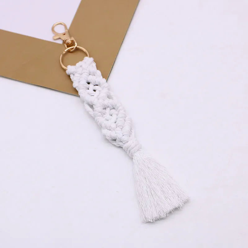 Hand-woven cotton tassel key chain in eight colours including brick red and rose pink for car keys and bag ornaments