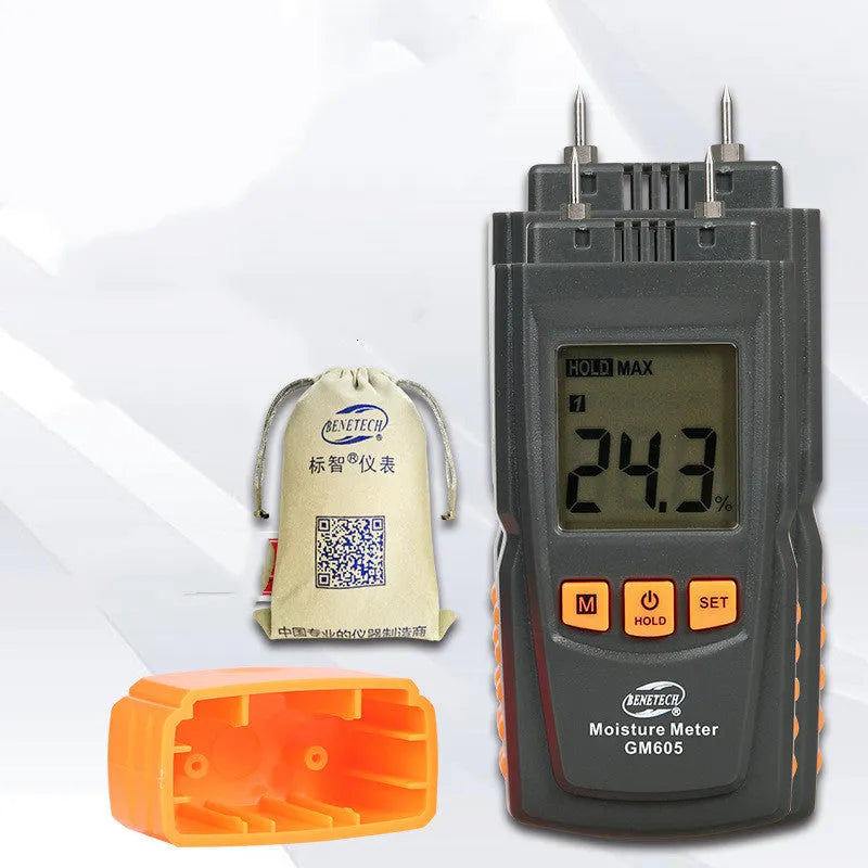 GM605 pin type wood moisture meter with black plastic casing and backlit LCD display