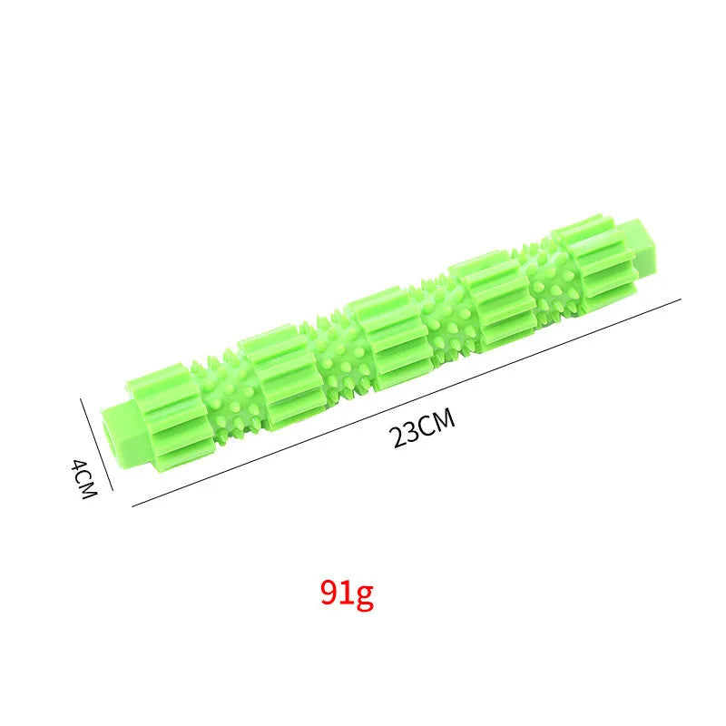 Green natural rubber dog chew toy with treat holes and squeaker for aggressive chewers