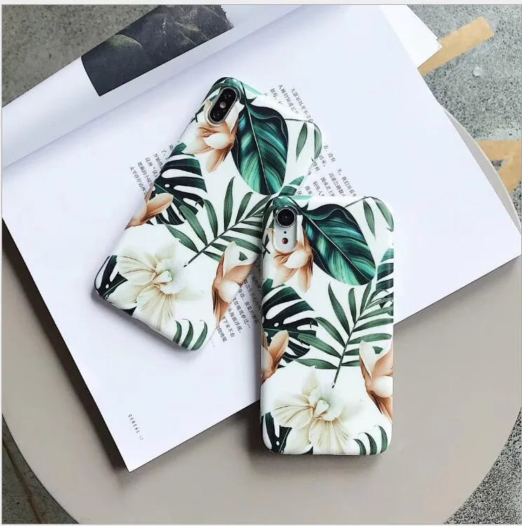 Soft TPU iPhone case with printed floral banana leaf design on the back.