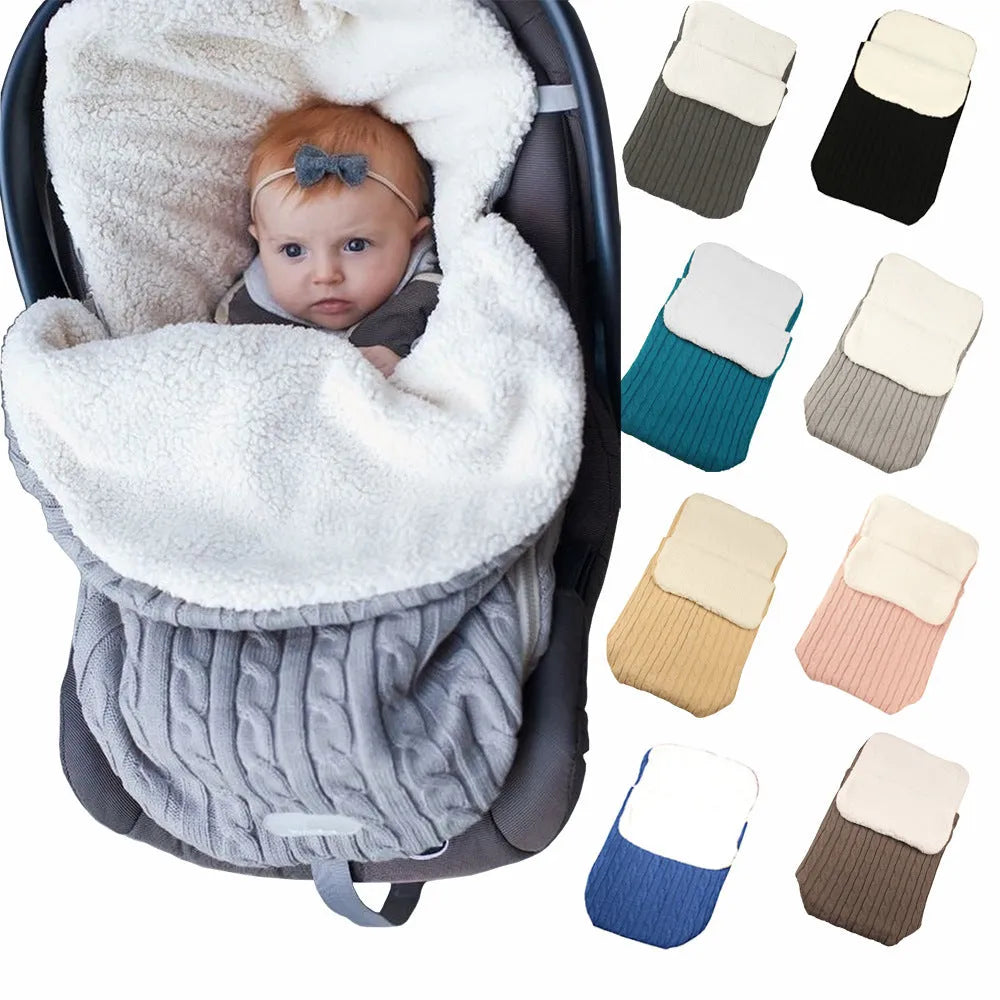 Envelope-style baby stroller sleeping bag in a choice of colours with cotton wool filling.