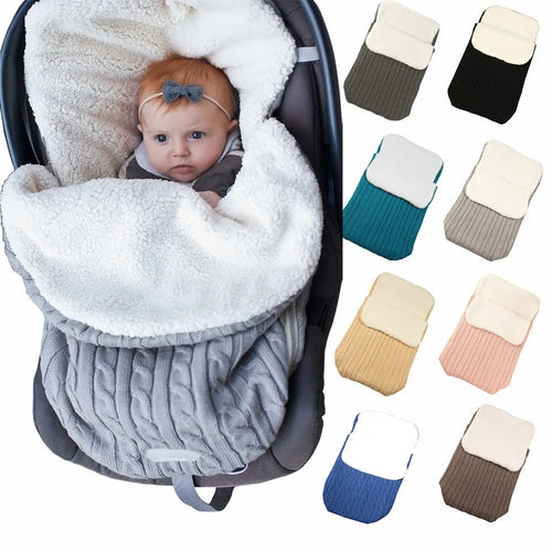 Envelope-style baby stroller sleeping bag in a choice of colours with cotton wool filling.