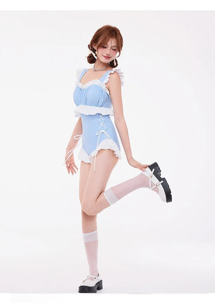 Light blue women's one-piece swimsuit with lace gathering on the chest, high waist, and backless design.