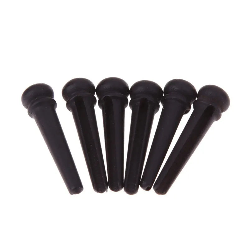 Six ebony guitar string nails with matt black finish for folk acoustic guitars