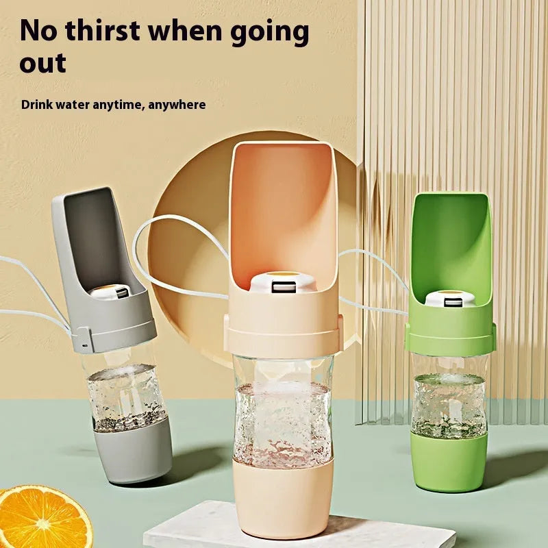 Green 2-in-1 travel dog water bottle and feeder with lanyard, folded to 20cm.