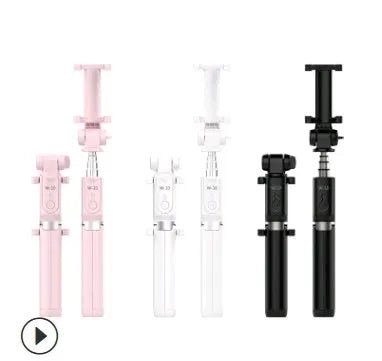 Aluminium Bluetooth selfie stick with tripod legs extended and wireless remote on a table