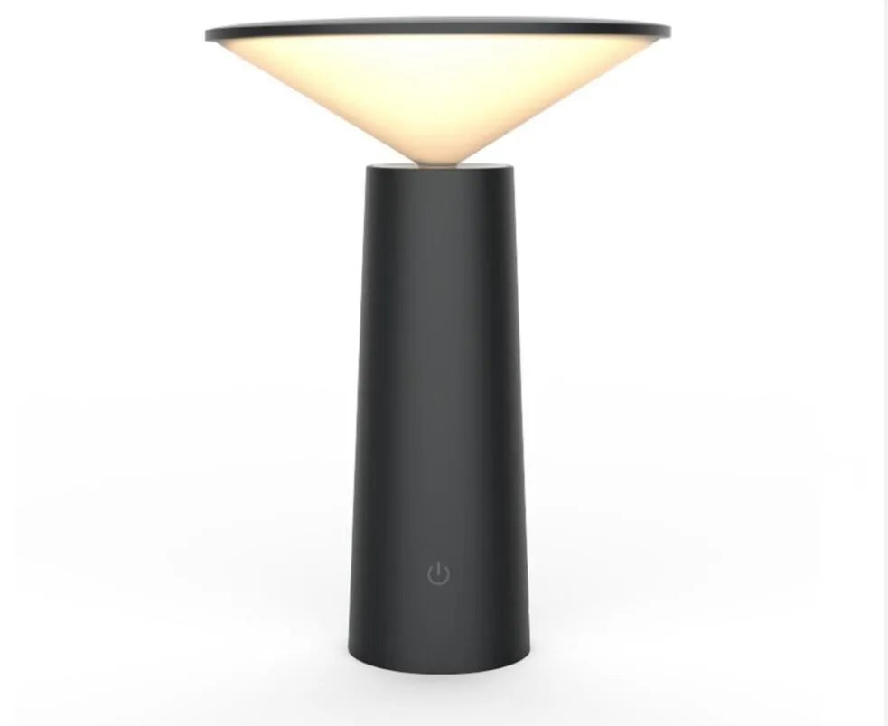 Black USB rechargeable LED desk lamp with touch sensor on a wooden desk, showing its adjustable lamp head.