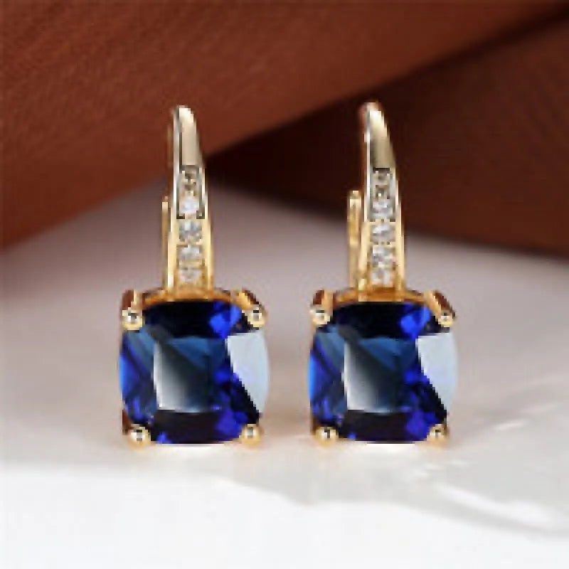 Square geometric ear clip with colourful moissanite inlay on an electroplated copper base.