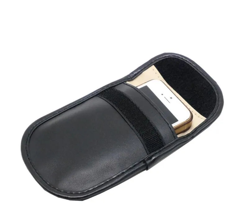 Black microfiber Faraday cage pouch for blocking car key fob and credit card signals.
