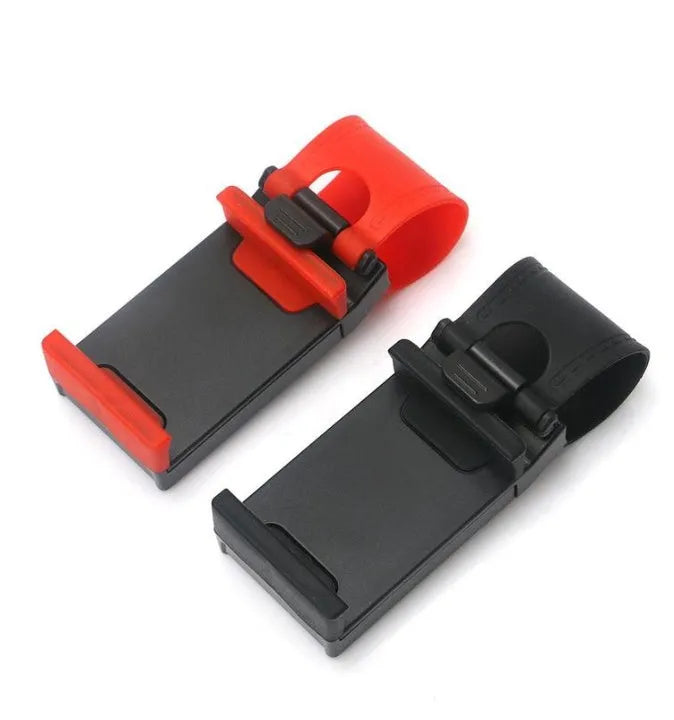 Black universal steering wheel phone holder clip mounted on a car steering wheel with a smartphone secured.