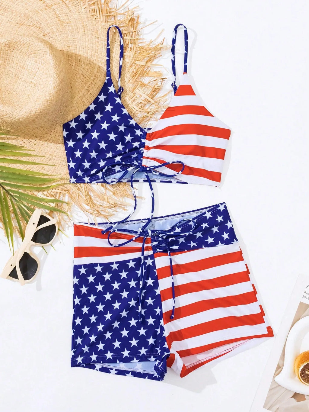 Women's high waist swimsuit with stars and stripes pattern and a drawstring waist.