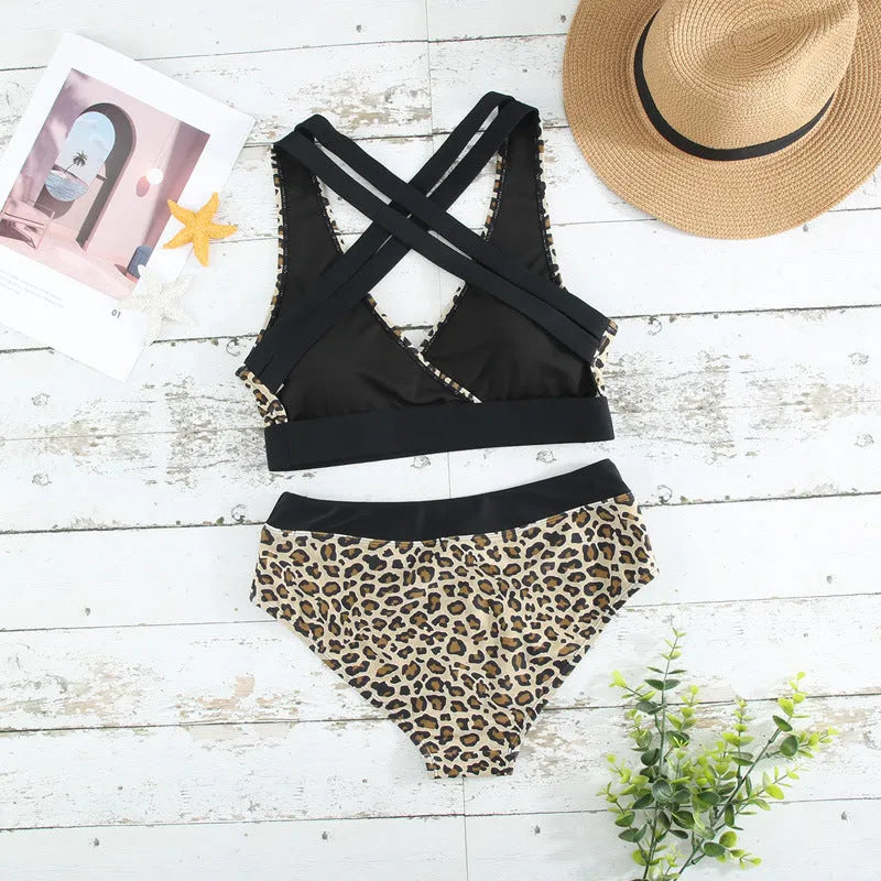Women's leopard print cross band bikini swimsuit with V-neck and high-leg cut.