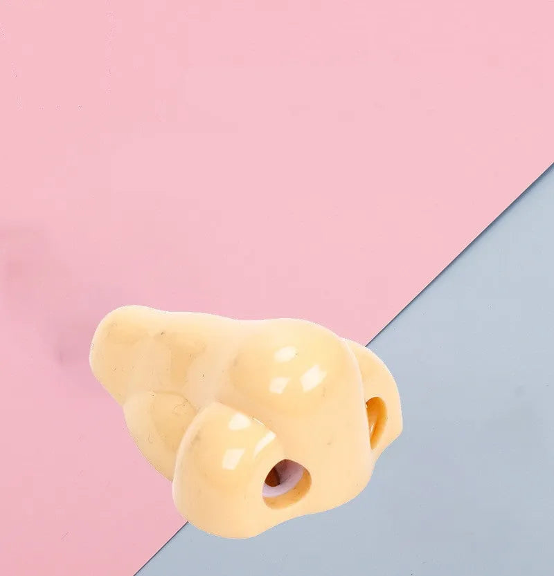 Flesh colour plastic pencil sharpener with geometry shape