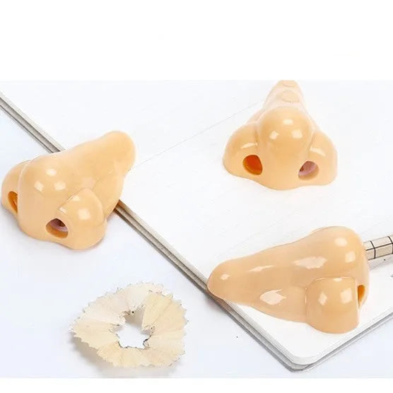 Flesh colour plastic pencil sharpener with geometry shape