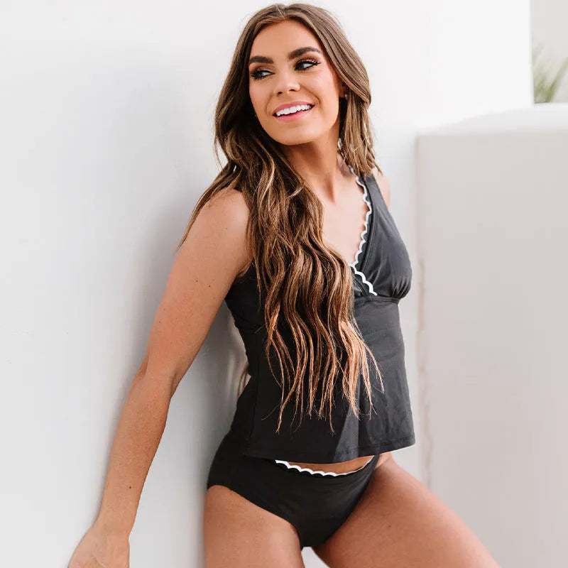 Black sleeveless one-piece women's swimsuit on a hanger