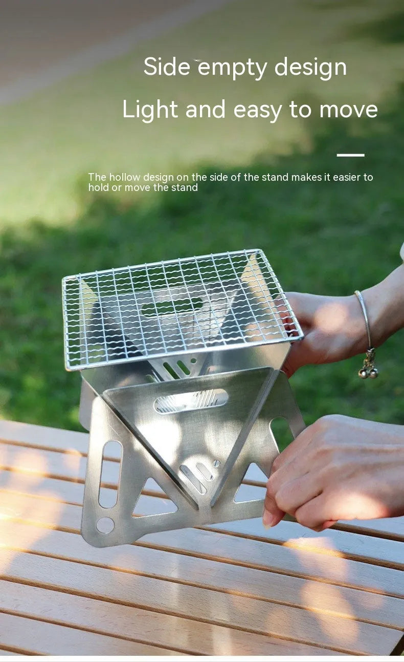 Large stainless steel folding barbecue oven with storage bag for outdoor use.