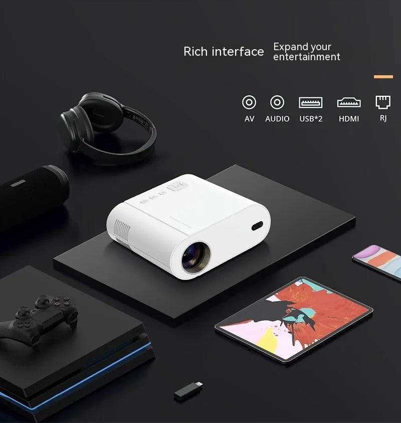White Full HD smart projector with remote control on wooden surface