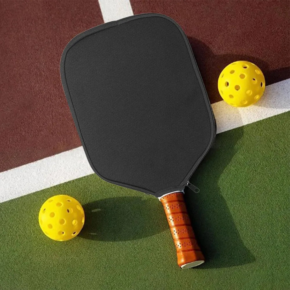 Black neoprene protective sleeve for a table tennis racket on a grey background.