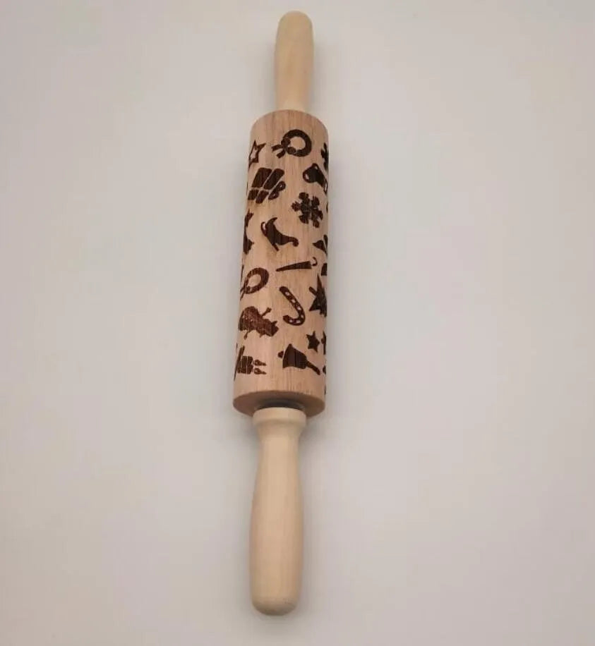 Wooden rolling pin with embossed Christmas pattern, measuring 45cm long.