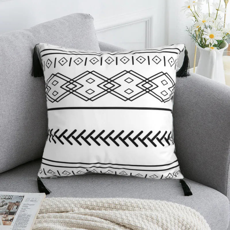 Bohemian style throw pillow on a sofa, available in light grey, black, or white, shown in 45x45cm size.