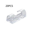 Transparent self-adhesive plastic cable clips for wire management in four different sizes.