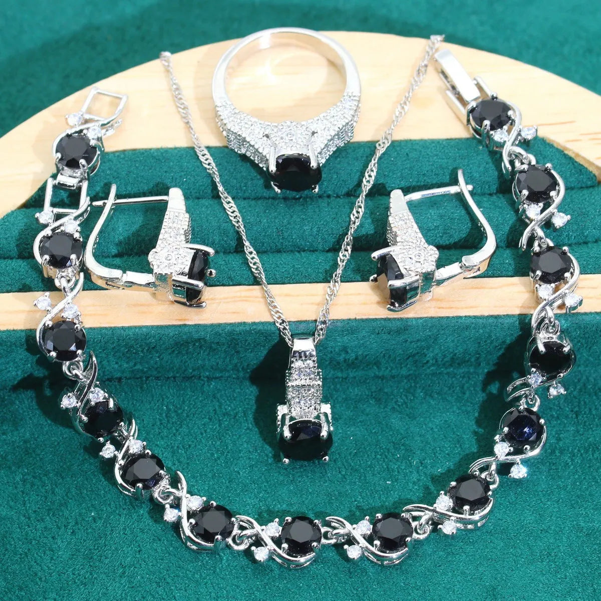 Four-piece bridal zircon jewellery set with necklace, earrings, bracelet and ring in water wave chain design