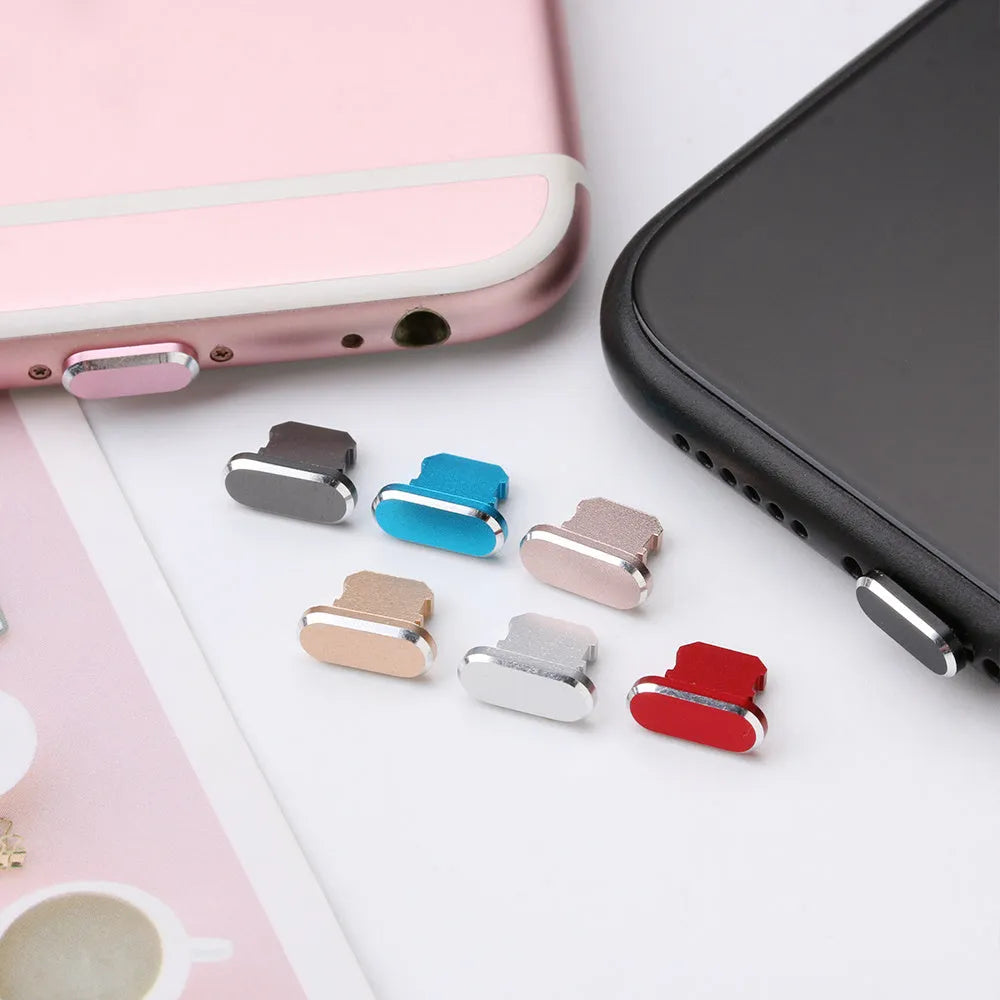 Aluminium alloy dust plug for iPhone charging port in various colours including gold, silver, blue, and rose gold.