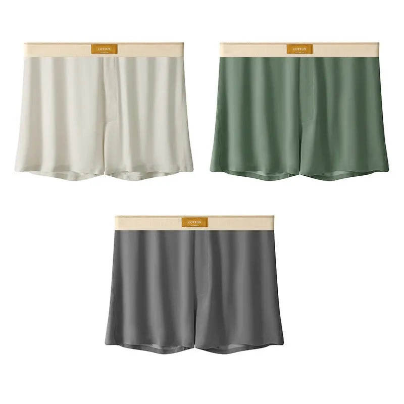 Men's solid colour loose ice silk underwear in a pack of three, shown in beige, black, and grey.