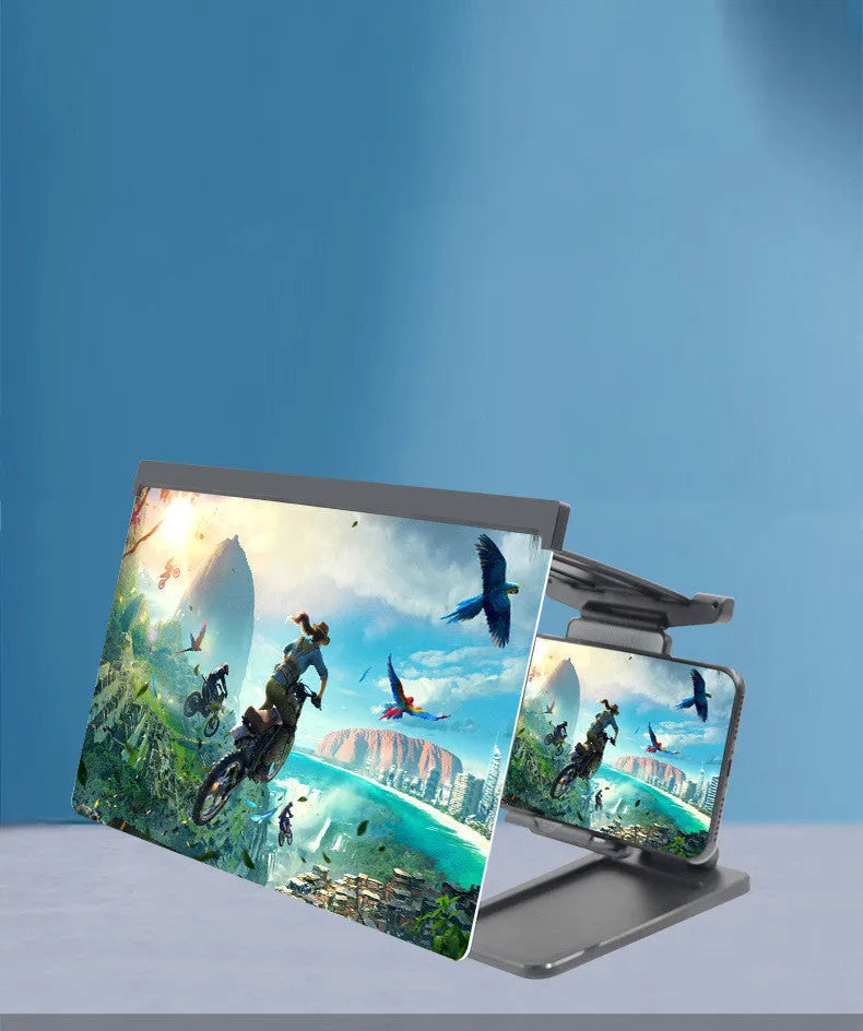 Black folding mobile phone screen magnifier with detachable holder on a desktop.