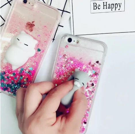 Four glittery cat design phone cases for iPhone models 6 to X on a table.