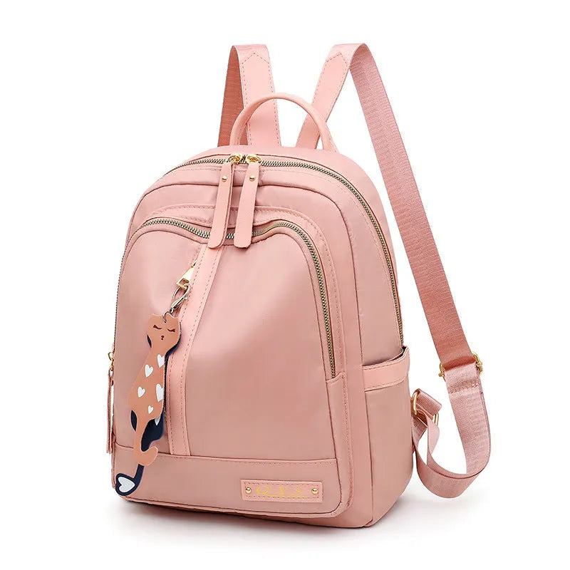 Women's black casual nylon backpack with shoulder straps showing external pockets and organised interior compartments