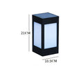 Set of solar-powered waterproof garden lights installed along a lawn edge and on a wall.