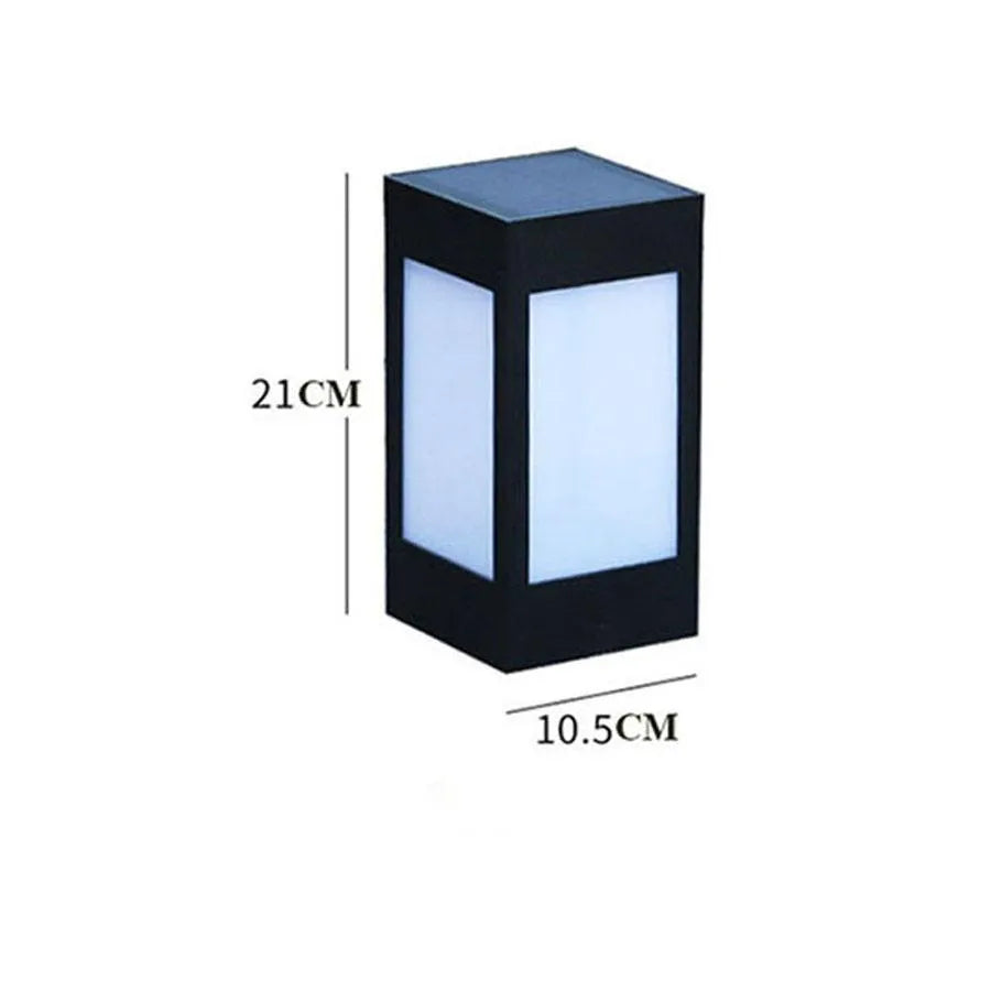 Set of solar-powered waterproof garden lights installed along a lawn edge and on a wall.