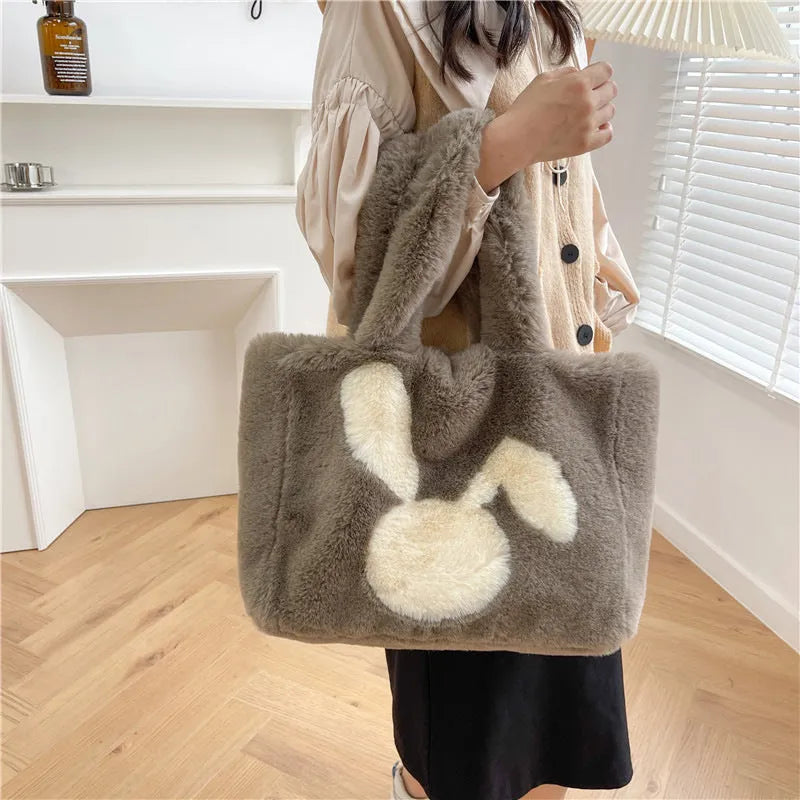 Cute cartoon rabbit ears plush shoulder tote bag in a solid colour.