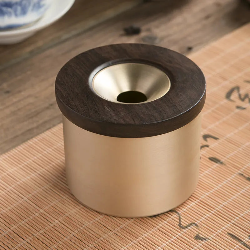 Brass ashtray with wooden lid in retro design for living room decor