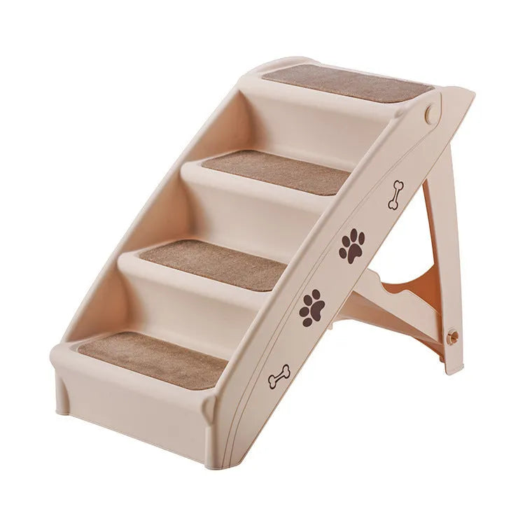 Foldable grey plastic pet ladder with non-slip stairs next to a sofa for small dogs and cats.