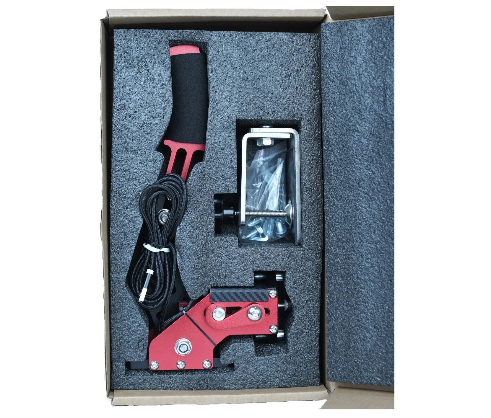 Black USB handbrake with aluminium bracket and clamp for PC racing simulators next to a racing wheel.