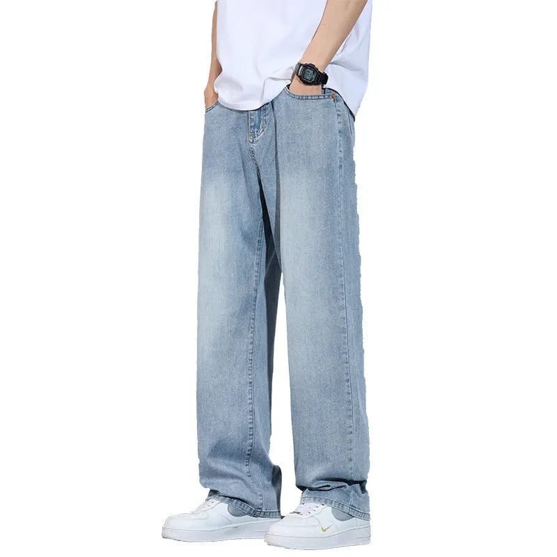 Straight-leg denim trousers in UK2560 blue with wide-leg silhouette and zip fly opening