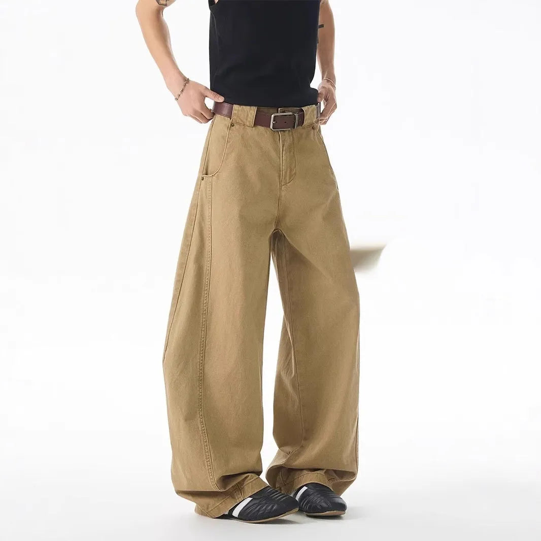 Brown men's loose fit straight leg denim jeans with a mid waist and button fly, shown laid flat.