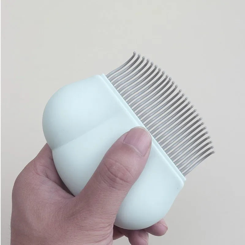 Blue soft silicone pet deshedding brush for cats and dogs on a white background