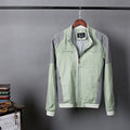 Men's thin blue cotton linen jacket with long sleeves, shown on a hanger.