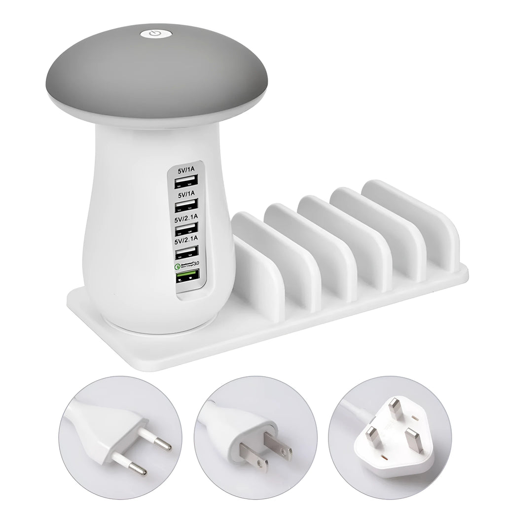 White mushroom-shaped LED desk lamp with 5 USB charging ports at its base on a wooden table.