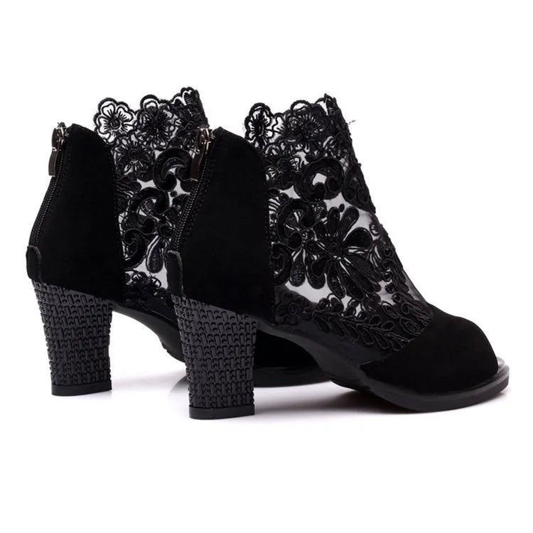 Women's black lace gladiator sandals with square heel, floral pattern, and peep toe design