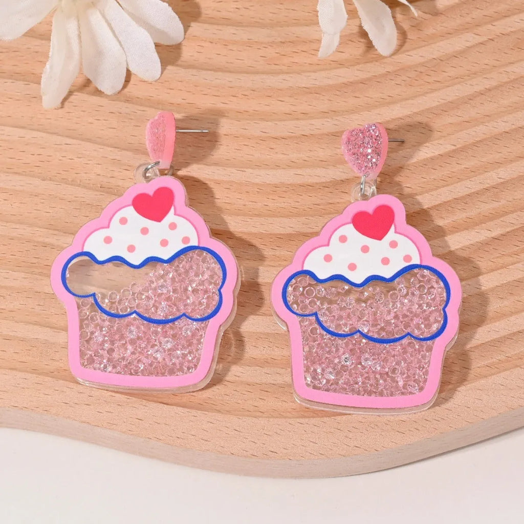 Colourful acrylic earrings with fruit and dessert designs including cherry, strawberry and watermelon shapes