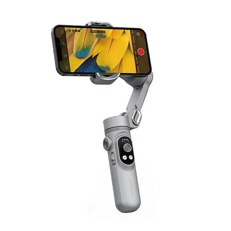 Silver grey smartphone gimbal stabiliser with extended arms and Bluetooth remote control on a table.