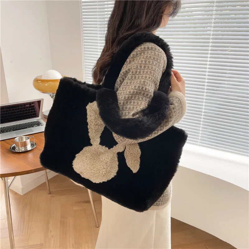 Cute cartoon rabbit ears plush shoulder tote bag in a solid colour.