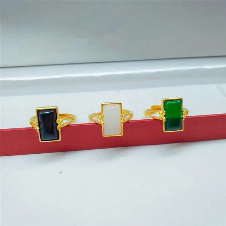 Adjustable brass gold-plated ring with black gemstone inlay and electroplated finish