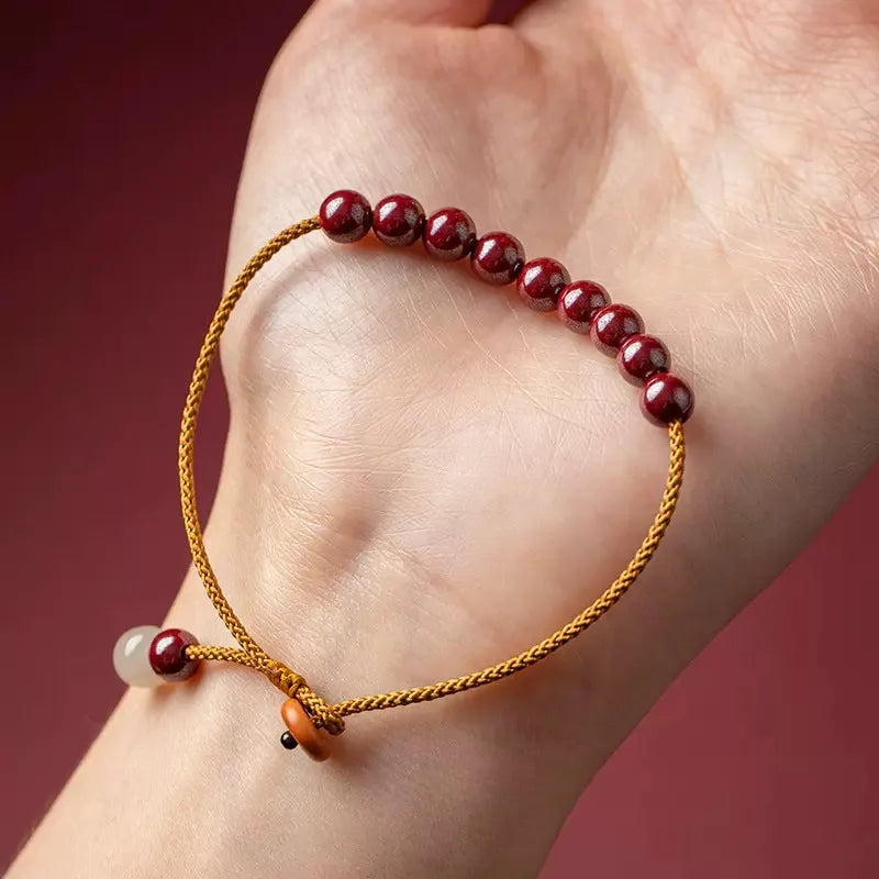 Cinnabar and Hetian jade bracelet with geometric beads on adjustable hand-woven cord